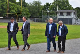 Member of Parliament for Kings-Hants Kody Blois (left), TAAC Ground Revitalization Committee president Brian Wood, Truro-Bible Hill-Millbrook-Salmon River MLA Dave Ritcey and Town of Truro Mayor Bill Mills walk the gravel track of the TAAC Grounds following the funding announcement for the facility Friday morning. A new synthetic track is part of the upgrades.