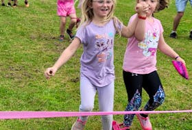 Claire Gillis, left and Nora Smith competed in the three-legged race during the Prince County Boys and Girls Club Olympic Games. Contributed