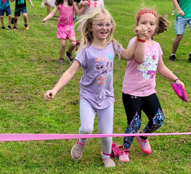 Claire Gillis, left and Nora Smith competed in the three-legged race during the Prince County Boys and Girls Club Olympic Games. Contributed