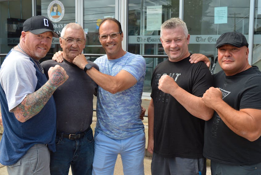 For the first time in 32 years, members of the Charlottetown Boxing Club, now called the Koed Boxing Academy, reunited in Charlottetown and sat down with SaltWire Network for an interview on Aug. 11. From left, are Trevor MacAdam, boxer; Howard Watts, trainer and coach; Robert Tierney, boxer; Jerry Ryan, boxer; and Brad Kennedy, boxer. Dave Stewart • The Guardian
