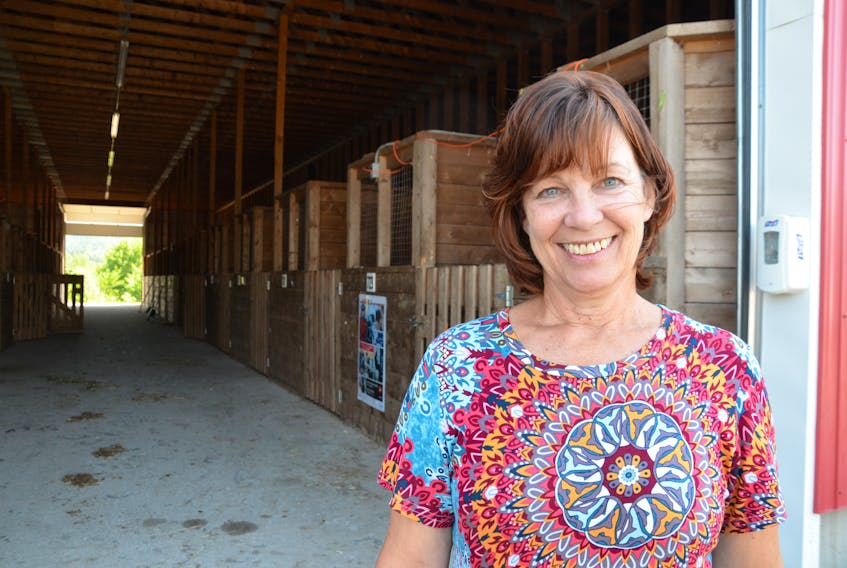 Annapolis Valley Exhibition general manager Gidget Oxner stands outside the horse barn on a bright, sunny day. The Lawrencetown venue won't be so quiet Aug. 15-20 as the Valley Ex hosts dozens of events and thousands of people after a two-year hiatus.