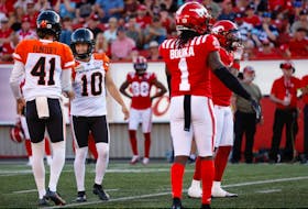 BC Lions kicker Sean Whyte celebrates with holder Stefan Flintoft after game winning field goal against the Calgary Stampeders  during CFL football in Calgary on Saturday, August 13, 2022. Al CHAREST / POSTMEDIA