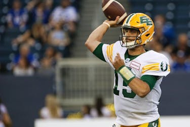 Edmonton Elks quarterback Taylor Cornelius (15) throws against the Winnipeg Blue Bombers in this file photo from Winnipeg on May 27, 2022.