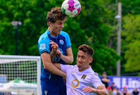 HFX Wanderers' Samuel Salter heads the ball over a Valour FC defender during a Canadian Premier League match Saturday afternoon at the Wanderers Grounds. - TREVOR MacMILLAN / CANADIAN PREMIER LEAGUE