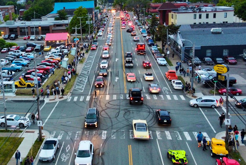 Downtown Sydney was the place to be on Friday and Saturday evenings as George Street came to life with the Hot August Nights car show. The above aerial photograph, taken Saturday evening, shows George Street looking north past the intersection with Pitt Street. The automobiles and the great weather brought thousands of people downtown to check out the buzz. DAVID JALA/CAPE BRETON POST