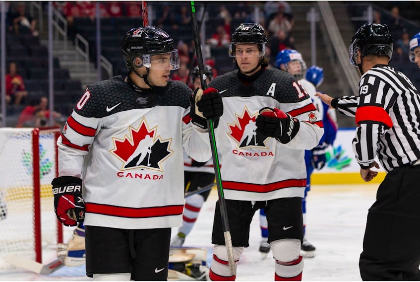 Team Canada's Logan Stankoven (10) celebrates a goal with teammates  during World Junior Hockey Championship action at Rogers Place in Edmonton, on Thursday, Aug. 11, 2022.