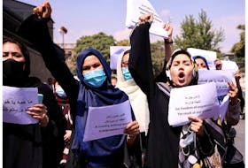 Afghan women's rights defenders and civil activists call on the Taliban to respect their achievements and education, in front of the presidential palace in Kabul last September. Despite their efforts, women's rights are being eroded.