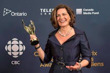 Lisa LaFlamme holds her award for best news anchor at the Canadian Screen Awards in Toronto on March 1, 2015.  