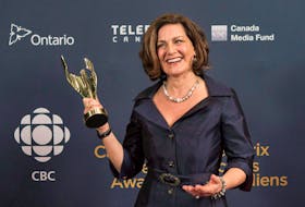 Lisa LaFlamme holds her award for best news anchor at the Canadian Screen Awards in Toronto on March 1, 2015.  