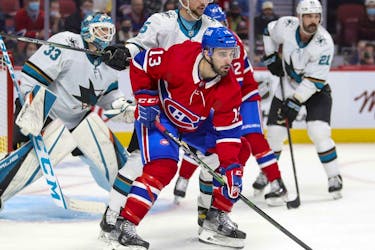 Montreal Canadiens' Cédric Paquette fights for position with San Jose Sharks' Erik Karlsson during third period in Montreal on Oct. 19, 2021. 