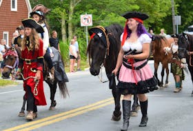 Pirates lead their trusty steads along the Shelburne exhibition parade route. KATHY JOHNSON