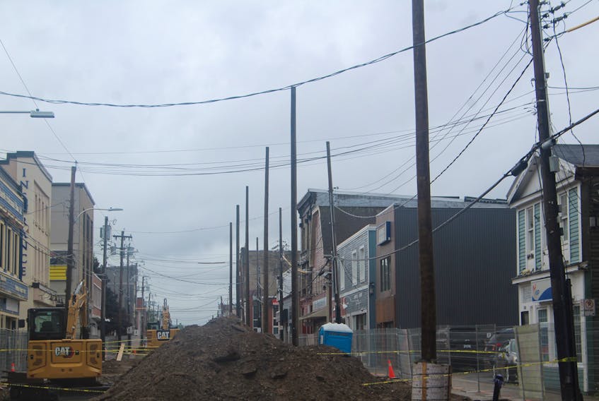 Wooden utility poles are being placed along Charlotte Street between Dorchester and Pitt streets as part of the first phase of the street's revitalization. IAN NATHANSON/CAPE BRETON POST