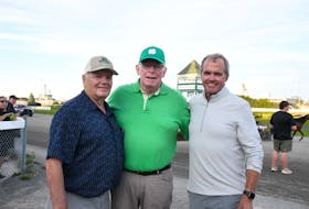 The Three Wisemen Stable has had the luck of the Irish with trotter Irish Ray. Stable members are, from left: Fred MacDonald, Ray Murphy, and Kent Scales. Contributed