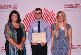 Carter Bruce, centre, receives the inaugural Jacob Simmons Memorial Scholarship from Simmons’ mother Brenda, left, and sister Janna. Contributed