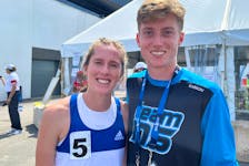 Nova Scotia 800-metre competitor Jane Hergett, left, and 1,500-metre runner Andrew Peverill celebrate their performances at the Canada Games in Niagara, Ont. - Len Wagg/Communications Nova Scotia