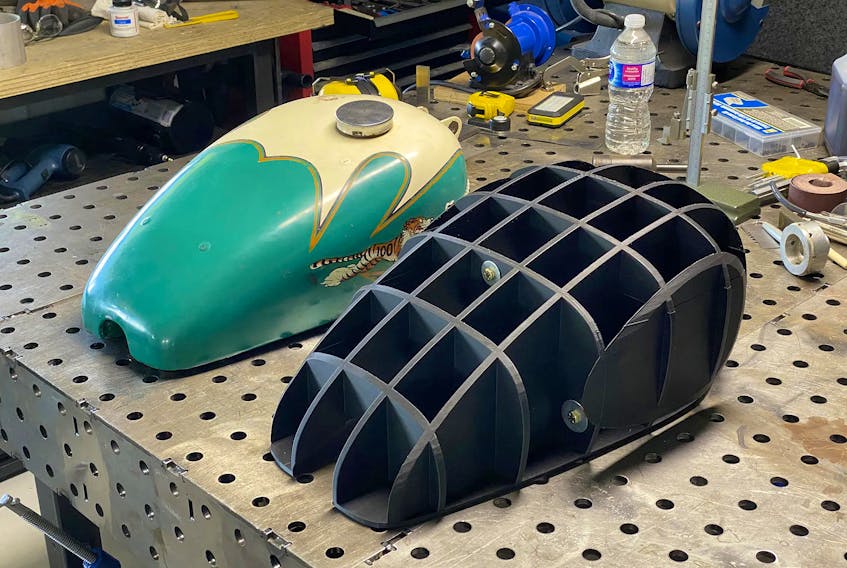 Kaetyn St. Hilaire’s rare Triumph TR5 gas tank in a custom period paint scheme (left). He had help 3D scanning the original and had a buck printed in 3D plastic and plans to produce a replica Triumph tank using an English wheel. Kaetyn St. Hilaire photo