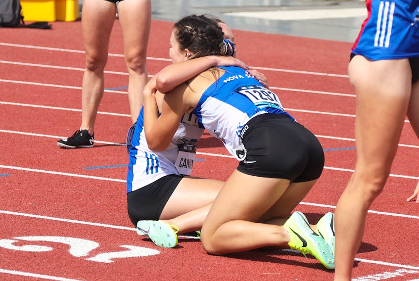 Breanna Sandluck, Thorburn, hugs her Nova Scotia teammate Mairin Canning following the women’s 3000m steeplechase final. Sandluck finished 12th and Canning placed sixth. ASHLEY NORTHCOTTE