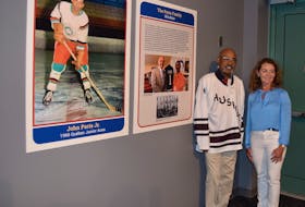 Percy Paris recently toured the hockey exhibit at the Museum of Industry along with Denise Taylor, marketing services operator at the MOI.