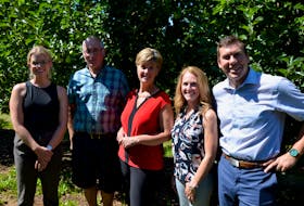 Nova Scotia Fruit Growers Association executive director and Kings County deputy mayor Emily Lutz, Noggins Corner Farm owner Andrew Bishop, Agriculture and Agri-Food Minister Marie-Claude Bibeau, Nova Scotia Fruit Growers Association president Janet Chappel and Kings-Hants MP Kody Blois on a tour of one of Noggins Corner Farm’s honey crisp apple orchards. KIRK STARRATT