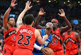 Minnesota Timberwolves forward Jarred Vanderbilt (8) controls the ball while defended by Toronto Raptors guard Fred VanVleet (23) and forwards Pascal Siakam (43) and Scottie Barnes (4) in the first half at Scotiabank Arena. 