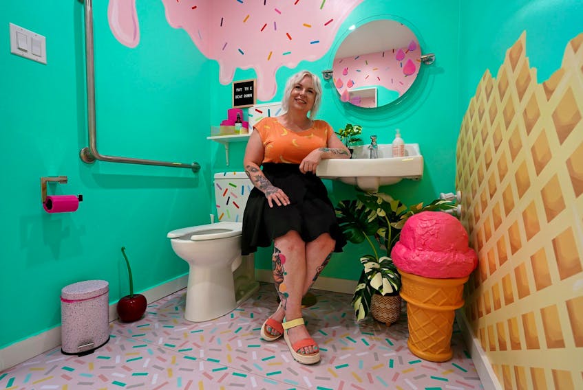 Julie Morrison, owner of the Edmonton boutique shop Majesty and Friends (10712 120 St.), sits in the store's restroom on August 17, 2022. The washroom won Cintas Canada's 13th annual Canada's Best Restroom competition. The winner is selected based on cleanliness, visual appeal, innovation, functionality and unique design elements. The award comes with a $2,500 credit for Cintas products and services.