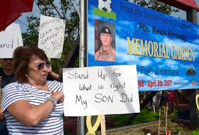 Kay Kennedy, mother of Pte. Kevin Kennedy, attends a rally Thursday, Aug. 18, in St. Vincent's to prevent the sale of the memorial garden named in his memory. Keith Gosse • The Telegram
