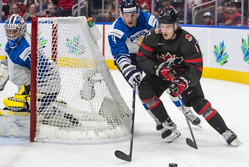 The status of Canada's Ridly Greig (seen in a world juniors game against Finland) for the rest of the world juniors is uncertain after he was injured in a game against Switzerland on Wednesday night.