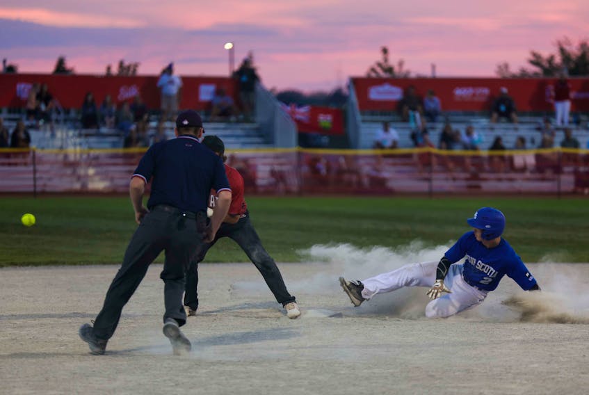 Truro's Nick White safely slides into second base during a Canada Games men's softball game against Ontario at Southward Community Park, Grimsby, Ont. - Len Wagg/Communications Nova Scotia
