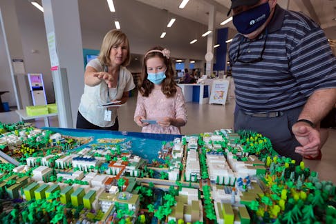 August 18, 2022--Artist Christine Hempel shows off areas to look for in a huge 3-D LEGO model of her "Eco-City" at the Woodlawn Public Library Thursday. Hempel, the Halifax Public Library’s Artist and Innovator in Residence. Hempel’s first tour is on display at the Woodlawn Public Library, from August 16-September 12. The display will then move on to the Halifax Central starting September 13. 
ERIC WYNNE/Chronicle Herald
