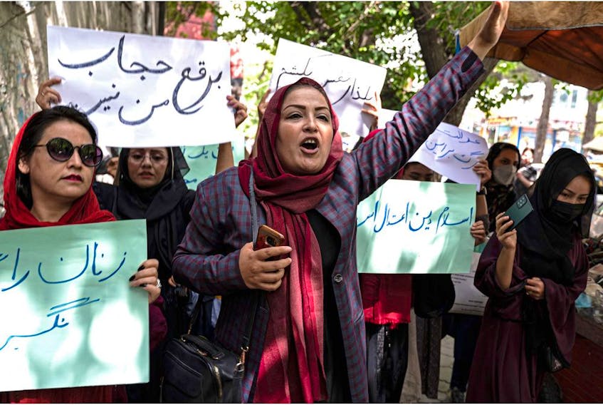 Members of Afghanistan’s women’s movement take part in a protest in Kabul on May 10, 2022, with some chanting "burqa is not my hijab,” after the Taliban ordered women to cover fully in public, including their faces. — Wakil Kohsar/Postmedia file photo