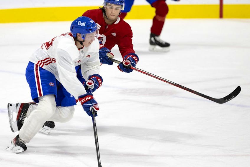 Canadiens prospect Joshua Roy, in red, checks second-round draft pick Owen Beck during development camp at the Bell Sports Complex in Brossard last month.