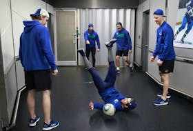 The Vancouver Canucks announced a number of hirings on Tuesday to round out their human performance department. Above, members of the team warm up prior to an April game against the Arizona Coyotes.