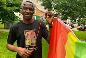 Okonkwo Chike Martin, with the Black Cultural Society of P.E.I., takes part in Emancipation Day celebrations in Rochford Square in Charlottetown Aug. 1. More than a dozen flags represented some of the countries where Black Islanders have their roots.