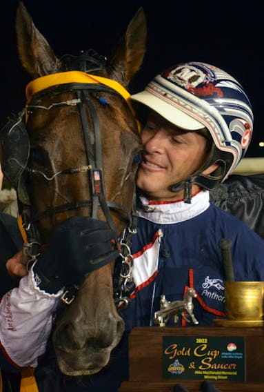 Driver Anthony MacDonald kisses Sintra in a crowded winner’s circle after winning the 63rd running of the Gold Cup and Saucer, presented by Atlantic Lottery Corporation, at Red Shores Racetrack and Casino at the Charlottetown Driving Park on Aug. 21. The duo combined to tie the track record of 1:50.1. Jason Simmonds • The Guardian