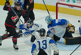 Team Canada's Joshua Roy (9) scores on Team Finland goalkeeper Juha Jatkola during first period gold medal final game action at  the International Ice Hockey Federation 2022 World Junior Championship in Edmonton, Canada on Saturday August 20, 2022.