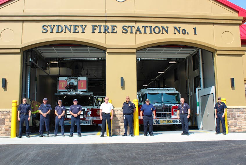 In this file photo, firefighters stand in front of the Sydney station. Currently, they are looking to hire six firefighters to replace people who have left. From left are, Michael MacNeil, Eugene Magee, Todd Ballah, Stephen MacVicar, Gilbert MacIntyre, Michael Seth, Alec Burns, Gary O'Brien, and Mark Jessome outside of the new Sydney Fire Station No. 1. — IAN NATHANSON/CAPE BRETON POST