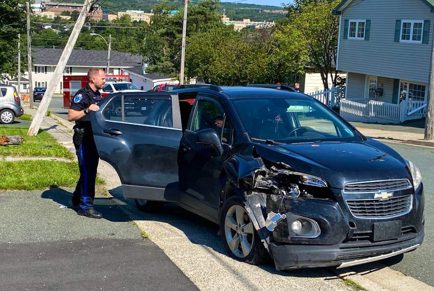This car struck and cracked off a utility pole on Suez Street in St. John's on Monday, Aug. 22, 2022.