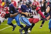  Stampeders defensive lineman Terrell McClain and Mike Rose close in before sacking Argonauts quarterback McLeod Bethel Thompson on Saturday.