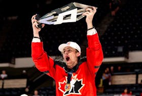 Halifax Mooseheads defenceman Dylan MacKinnon hoists the Hlinka Gretzky Cup after helping Canada win a gold medal earlier this summer. - Hockey Canada