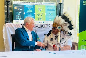 Fortescue Future Industries Canada Country Manager Stephen Appleton and Miawpukek Chief Mi'sel Joe sign an MOU Monday in western Newfoundland