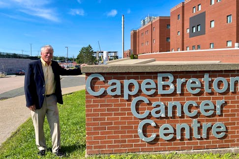 Dr. Rex Dunn stands next to the sign for the Cape Breton Cancer Centre. He and his wife recently donated to the Cancer Care Here at Home campaign.
PHOTO CREDIT: Contributed