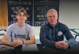 Charlottetown Islanders Marcus Kearsey, left, and general manager and head coach Jim Hulton chat after the defenceman signed with the Quebec Major Junior Hockey League team for the 2022-23 season earlier this week. The Islanders selected Kearsey with their first pick in the 2022 draft. Contributed