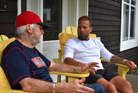 Mike O’Neil of the St. John’s Capitals, right, shares a personal conversation with Sydney Sooners manager Jim (Rico) McEachern at McEachern’s home in Ben Eoin on Wednesday. O’Neil played for McEachern with the Sooners during the 1994 Nova Scotia Senior Baseball League season and become close friends with Jim and his late wife Susan. JEREMY FRASER/CAPE BRETON POST