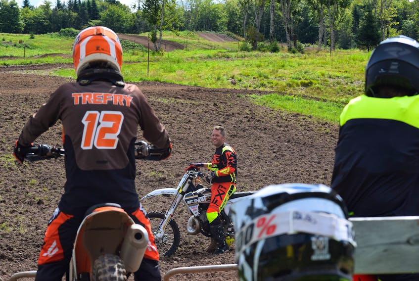 Students listen to David Estabrooks’s lesson on how to get the best start during instruction at Mt. Thom MX Park.