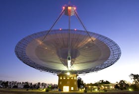 The Parkes telescope in Parkes, Australia is part of the Commonwealth Scientific and Industrial Research Organization. Researchers used the telescope to detect the first population of radio bursts known to originate from beyond our galaxy. Photo courtesy of NASA Image and Video Library