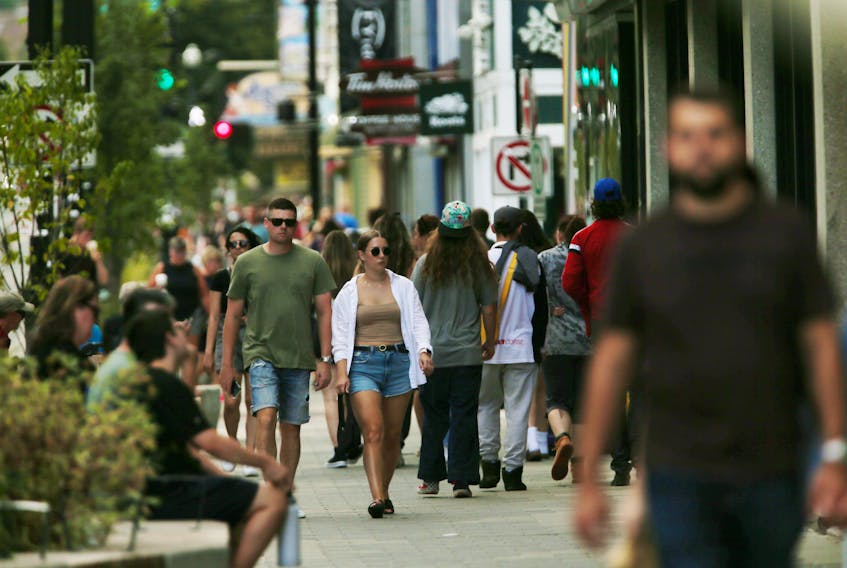 People walk along a busy sidewalk on Spring Garden Road in Halifax on Thursday, Aug. 25, 2022. - Tim Krochak