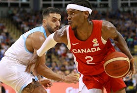 Canada's Shai Gilgeous-Alexander moves around Argentina's Facundo Campazzo during the FIBA Basketball World Cup 2023 Americas Qualifiers in Victoria, B.C., on Thursday, August 25, 2022. 