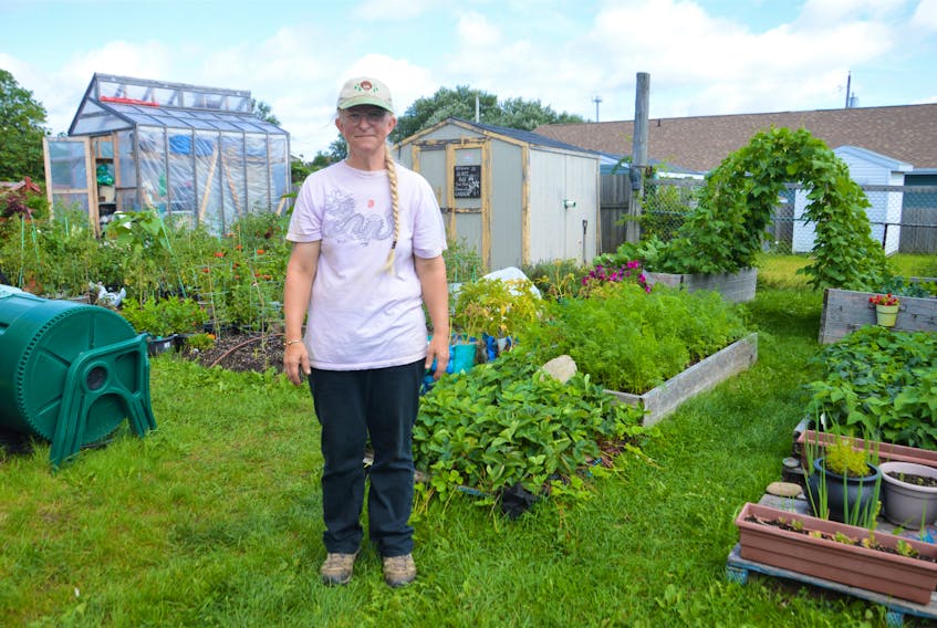 Kimberly McPherson stands in the community garden behind the Glace Bay Food Bank which she spends at least 40 hours a week cultivating to reap successful harvests of fruits and vegetables. NICOLE SULLIVAN/CAPE BRETON POST