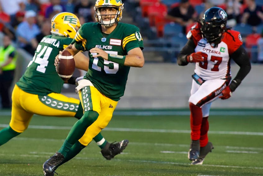 Edmonton Elks quarterback Taylor Cornelius (15) runs with the ball during first half CFL action against the Ottawa Redblacks in Ottawa on Friday, August 19, 2022.The Elks feel confident they can break their 12-game losing streak at Commonwealth Stadium when the Ottawa Redblacks visit on Saturday.