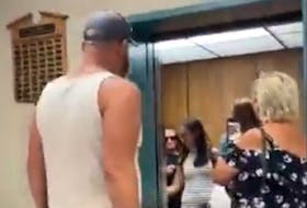  This still image from a video posted to social media shows Deputy Prime Minister Chrystia Freeland being verbally accosted as she visits Grande Prairie, Alta., on Friday, Aug. 26, 2022.
